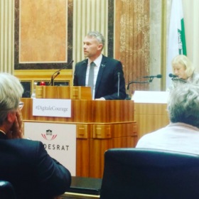Niko Alm with Laibach’s (Volk) badge in Austrian Parliament